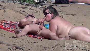 Blowjob on a nudist beach